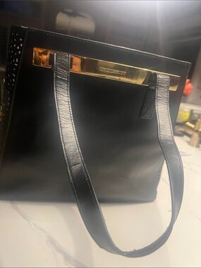 Vince Camuto Summer Tote with perforated sides and matching attached pouch.